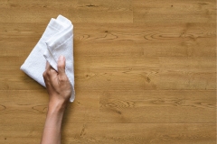 Cleaning table by woman hand